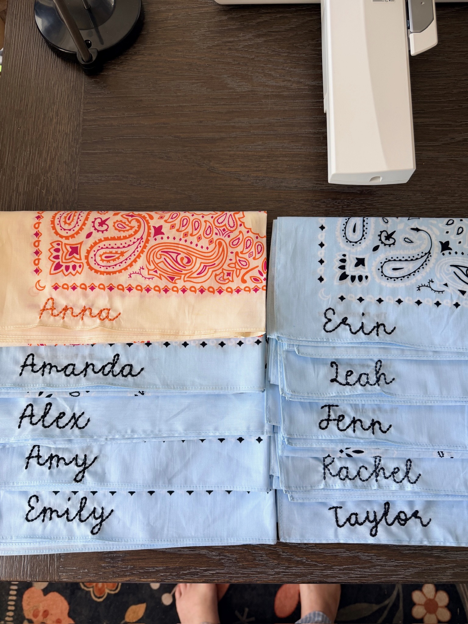Blue and orange paisley bandanas hand-embroidered with names like Anna, Amanda, Erin and Taylor