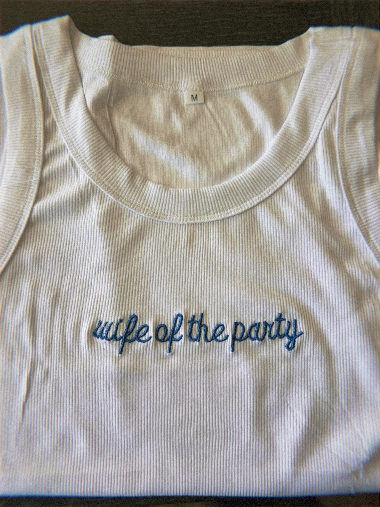White ribbed tank top embroidered wife of the party in blue script